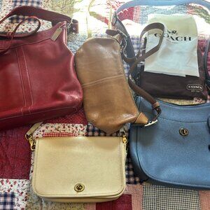 A quartet of Coach bags from different eras - includes two storage bags